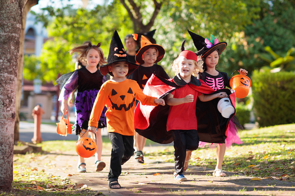 Kids trick or treat. Halloween fun for children.